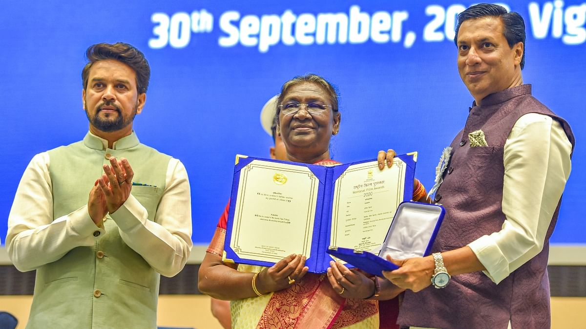 Murmu presents Best Bengali Film Award to director Madhur Bhandarkar during the 68th National Film Awards presentation ceremony. Credit: PTI Photo