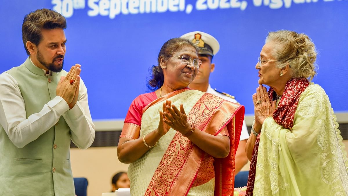 Dadasaheb Phalke Award winner Asha Parekh greets President Droupadi Murmu and Union Minister Anurag Thakur during the 68th National Film Awards presentation ceremony. Credit: PTI Photo