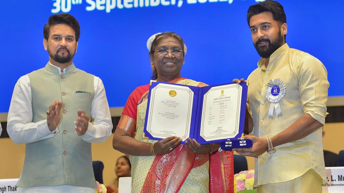 Murmu presents Best Actor Award to Tamil actor Suriya during the 68th National Film Awards presentation ceremony, at Vigyan Bhawan in New Delhi. Credit: PTI Photo