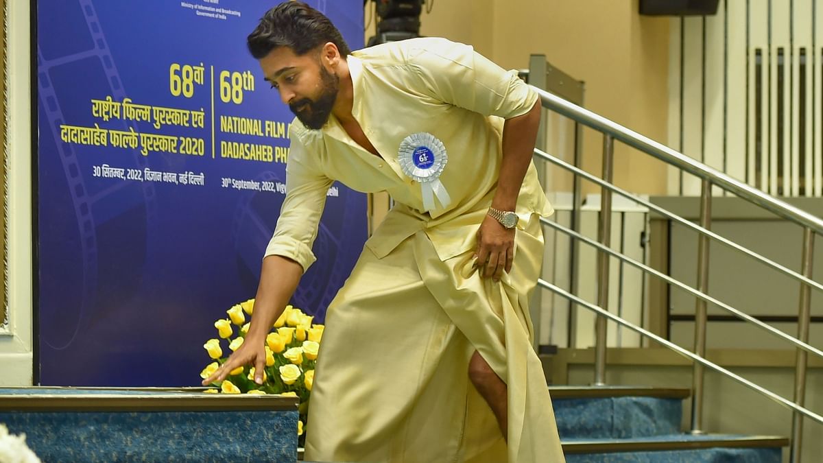 Kollywood actor Suriya arrives on the stage to receive the Best Actor Award during the 68th National Film Awards presentation ceremony. Credit: PTI Photo