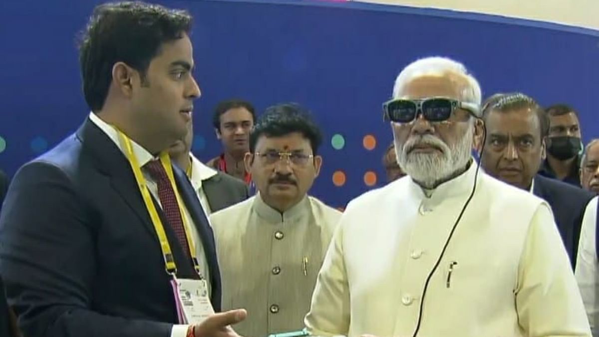 PM Modi witnessed the True 5G devices displayed at the pavilion and experienced the use cases through Jio Glass. Credit: PTI Photo