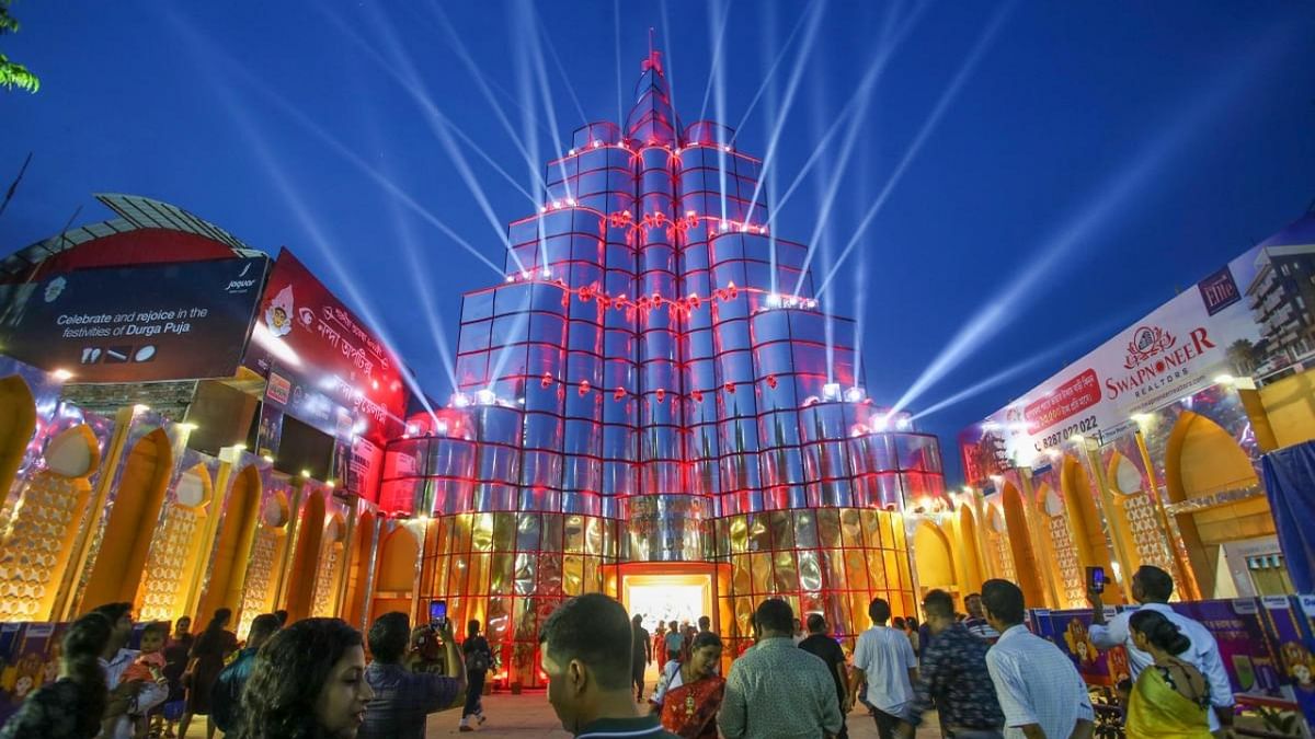 The Kolkata Police has made extensive bandobast to ensure peaceful celebration of the festival, apart from the herculean task of keeping roads free of congestion. A replica of Burj Khalifa at a Durga Puja pandal is seen in Agartala. Credit: PTI Photo