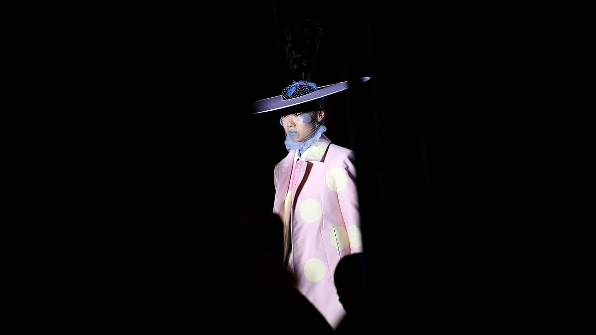 A model presents a creation for Thom Browne during the Spring-Summer 2023 fashion show as part of the Paris Womenswear Fashion Week, in Paris, on October 3, 2022. Credit: AFP Photo
