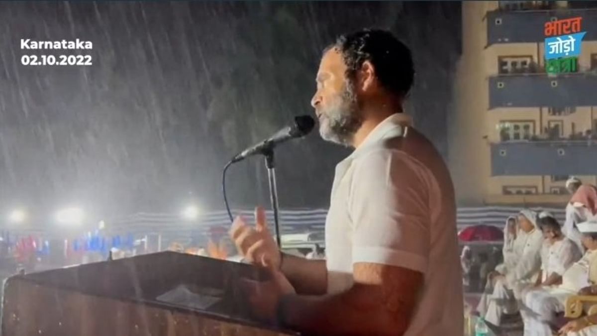 This gesture by Congress leader Rahul Gandhi won the hearts of netizens and soon social media was filled with pictures of him addressing the rally in heavy rains. Credit: INC