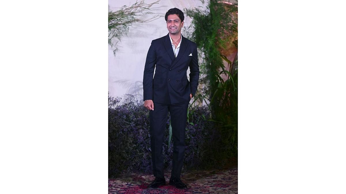 Vicky Kaushal poses for the cameras as he arrives for Richa Chadha and Ali Fazal's wedding reception. Credit: AFP Photo