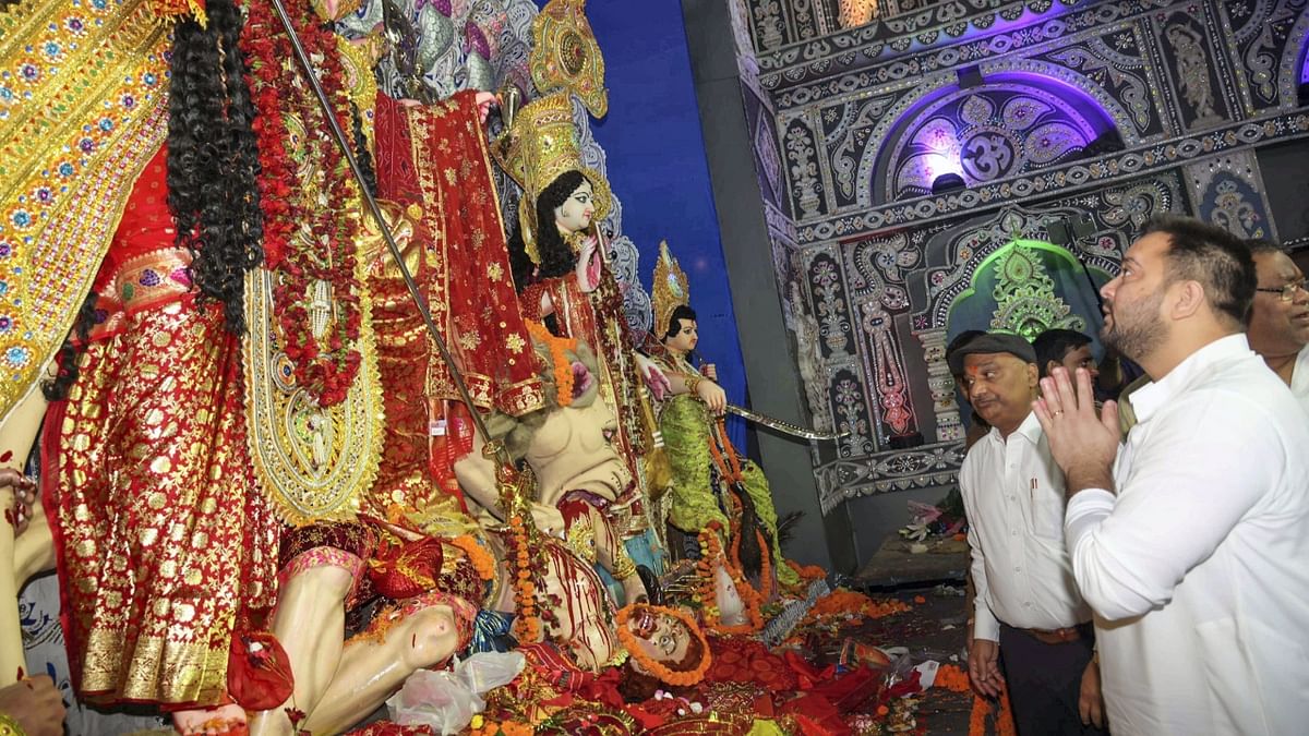 Bihar Deputy CM Tejashwi Yadav visited a Durga Puja pandal in Patna and paid obeisance. Credit: PTI Photo