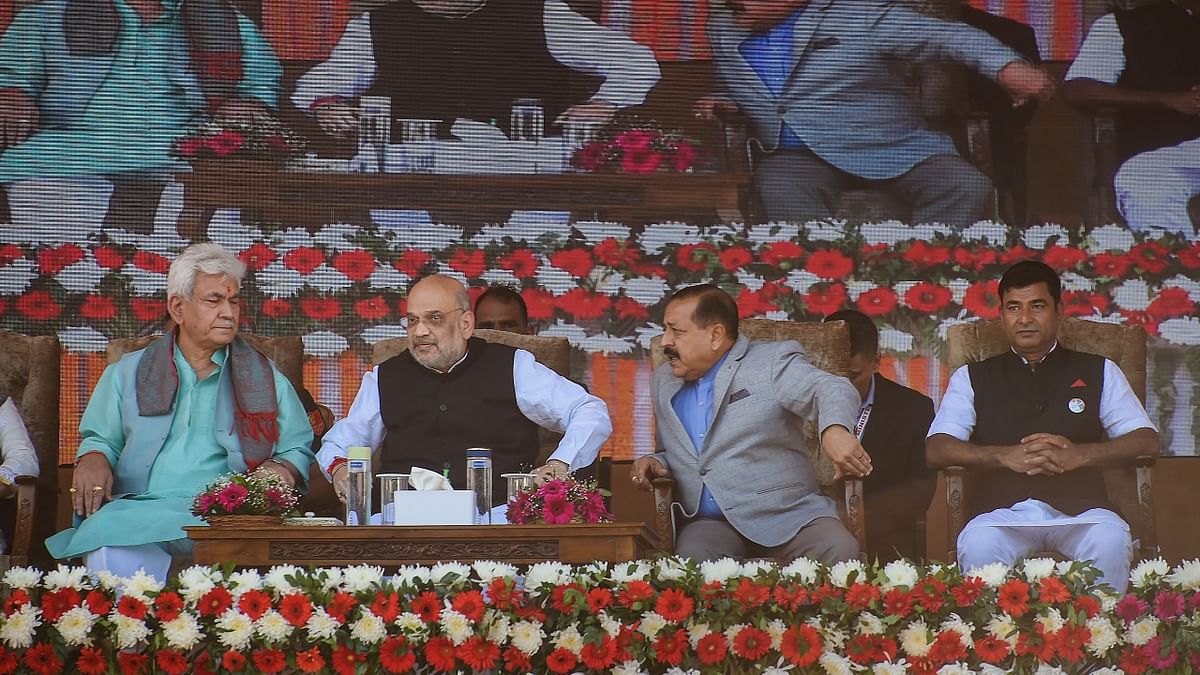 Amit Shah with J&K Lt Governor Manoj Sinha and MoS Jitendra Singh during a public rally at the Showkat Ali Stadium in Baramulla, Kashmir. Credit: PTI Photo