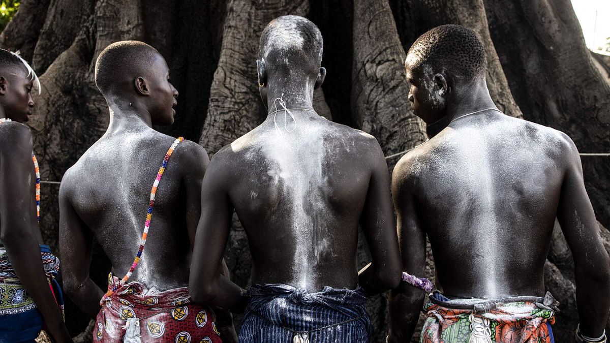 Young men, in the early stages of the initiation, attend a ceremony marking the end of the yearly initiation process for young men in Kabrousse, western Casamance, Senegal. Credit: AFP Photo