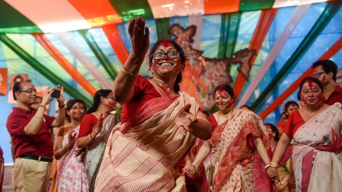 Married women dance as they participate in 'Sindoor Khela' on the last day of Durga Puja festival celebrations, in New Delhi. Credit: PTI Photo