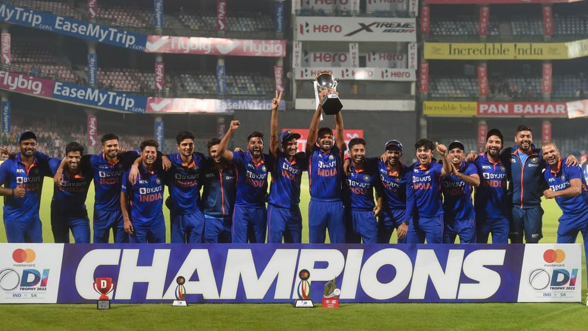 Indian players pose for photos with the trophy after winning the 3rd and final ODI cricket match of the series against South Africa, at the Arun Jaitley Stadium in New Delhi, Tuesday, Oct. 11, 2022. Credit: PTI Photo