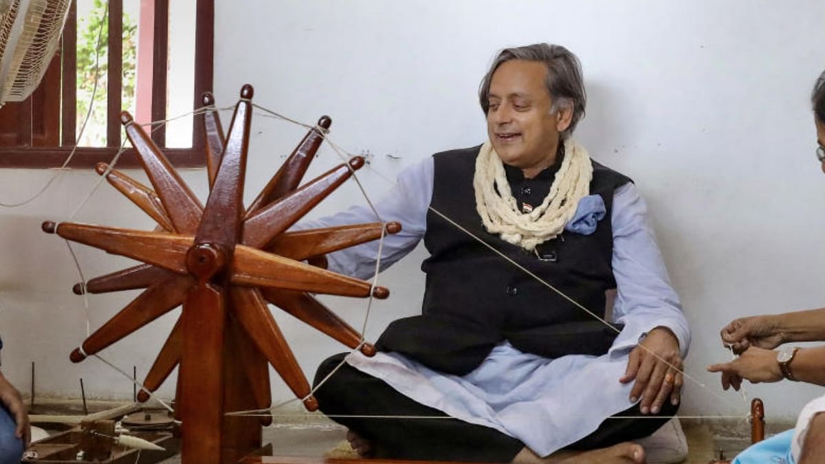 Senior Congress leader and Presidential candidate Shashi Tharoor spins a ‘Charkha’ during his visit to Sabarmati Gandhi Ashram, in Ahmedabad, Wednesday, October 12, 2022. Credit: PTI Photo