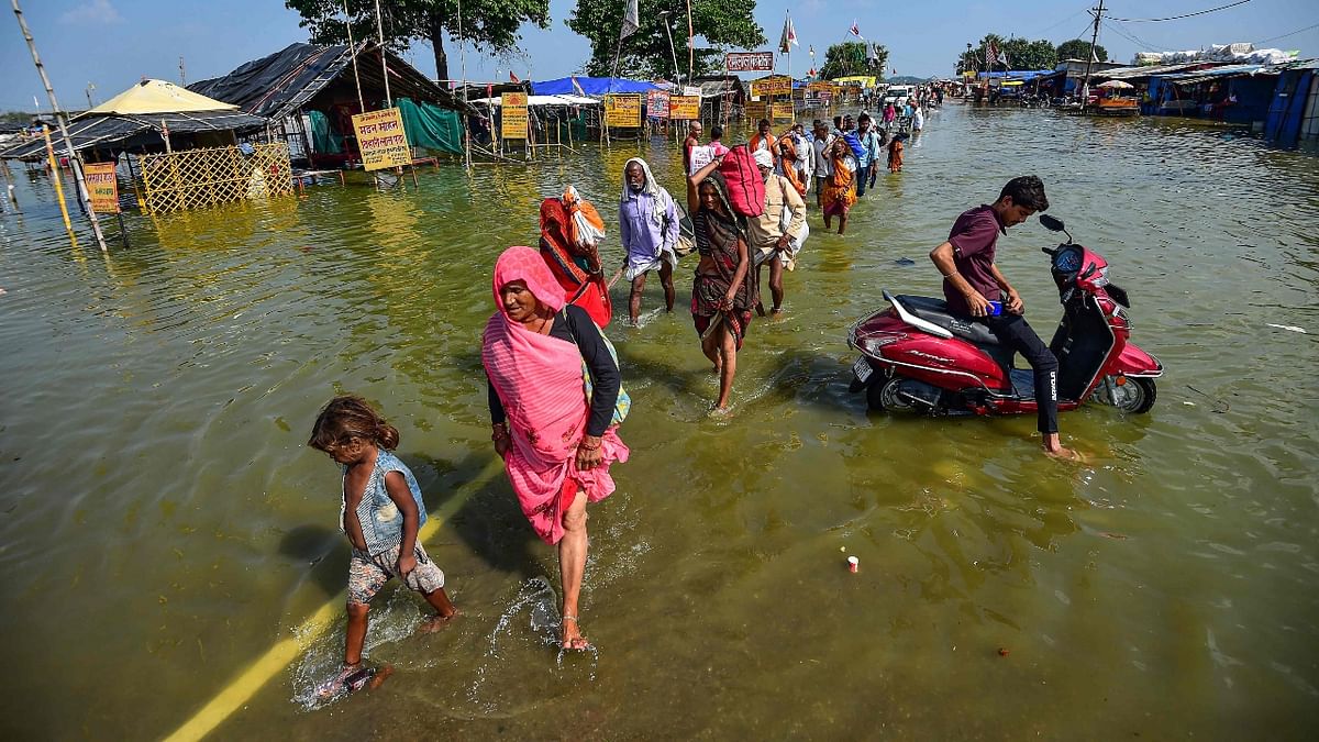 A population of about 25 lakh has been reportedly affected by floods in more than 1500 villages of 15 districts across the state. Credit: AFP Photo