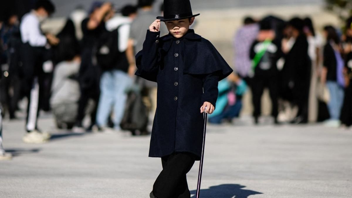 A child model poses a photos during the 2023 Spring/Summer Seoul Fashion Week at the Dongdaemun Design Plaza in Seoul on October 12, 2022. Credit: AFP Photo
