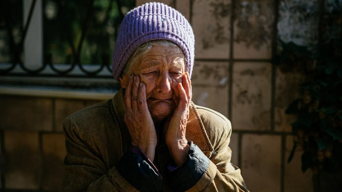 80 year-old Luba reacts during shelling in the town of Bakhmut on October 15, 2022, amid the Russian invasion of Ukraine. Credit: AFP Photo
