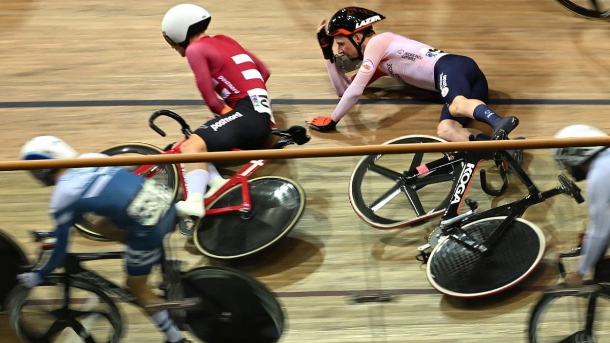- Netherlands' Philip Heijnen and Denmark's Tobias Hansen crash during the Men's Elimination finals during the UCI Track Cycling World Championships at the Velodrome of Saint-Quentin-en-Yvelines, southwest of Paris. Credit: AFP Photo