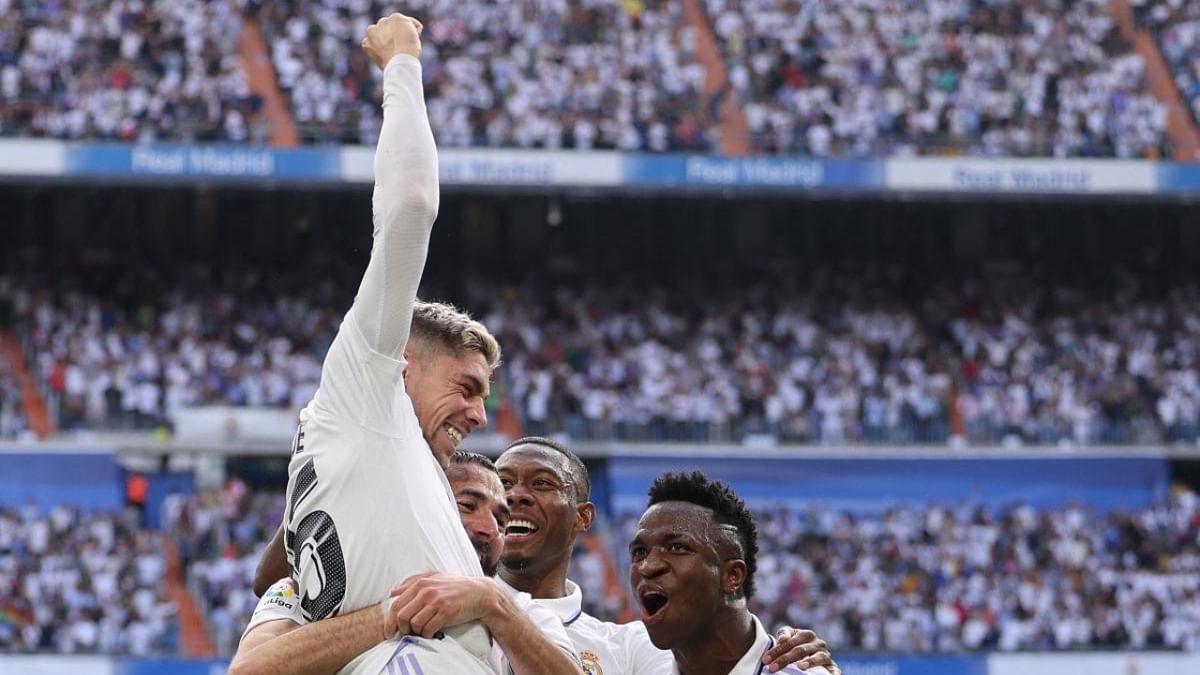 Real Madrid's Uruguayan midfielder Federico Valverde (L) celebrates with teammates after scoring his team's second goal during the Spanish League football match between Real Madrid CF and FC Barcelona at the Santiago Bernabeu stadium in Madrid. Credit: AFP Photo