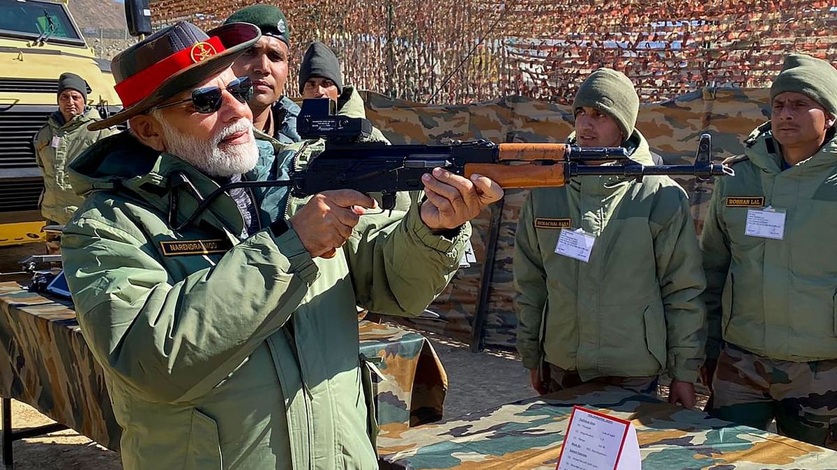 Amid the Diwali celebrations with members of the Armed Forces in Kargil, PM Modi was pictured inspecting an assault rifle. Credit: PMO