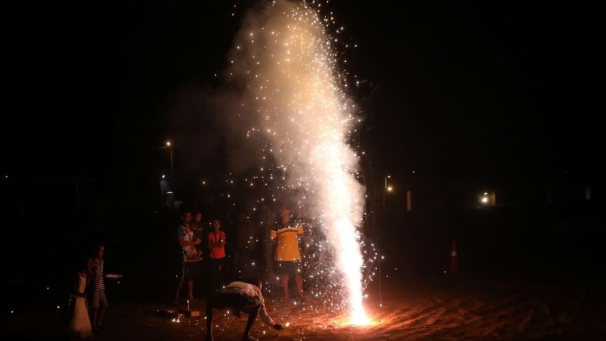People light fireworks to celebrate Diwali in Mumbai. Credit: Reuters Photo