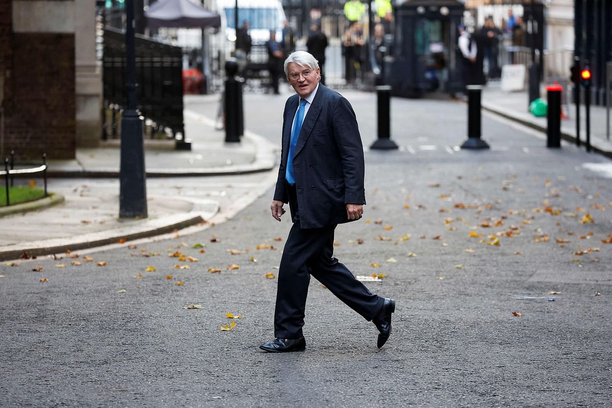 British Minister for Development Andrew Mitchell walks at Downing Street. Credit: Reuters Photo