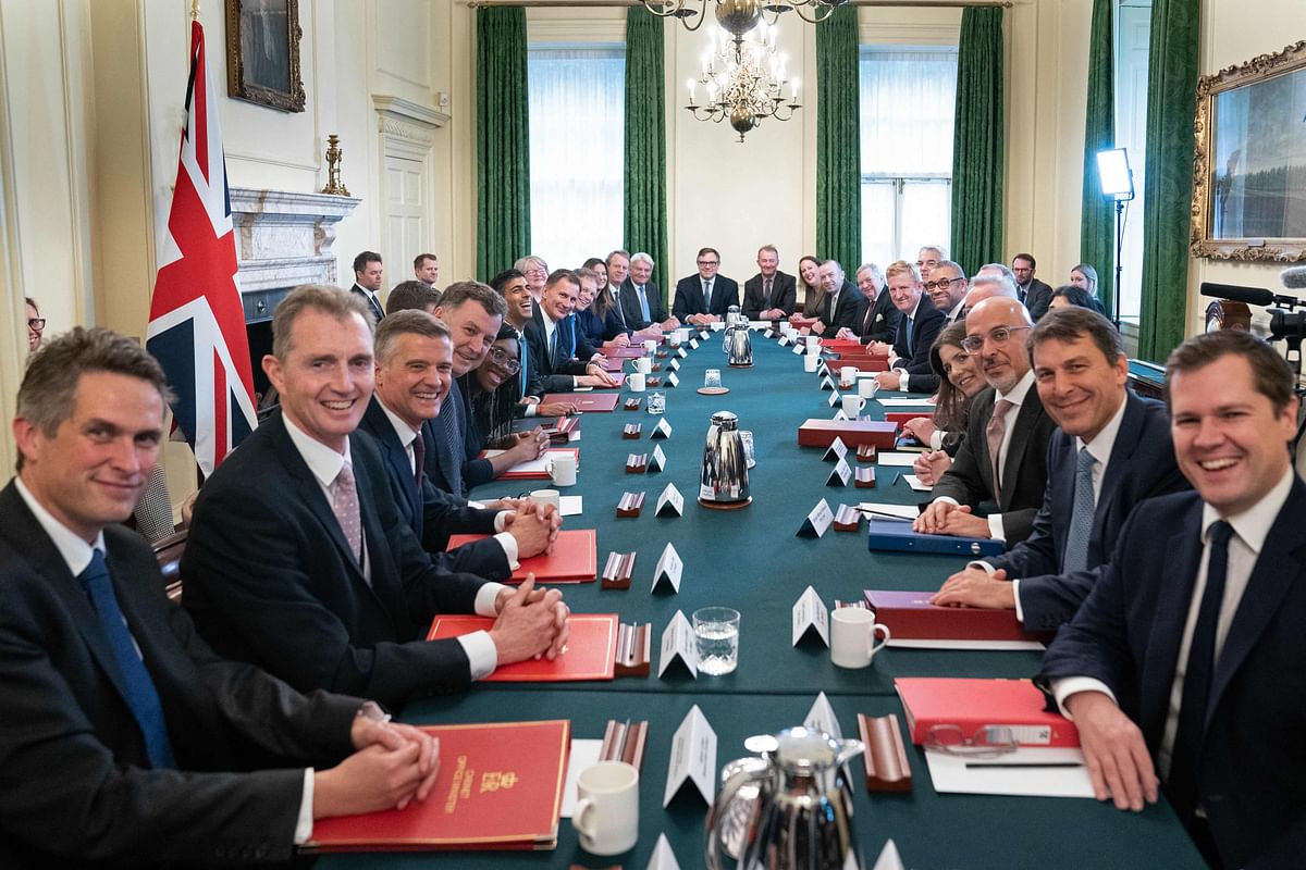 Britain's Prime Minister Rishi Sunak (6th L) poses for a photograph alongside members of his new cabinet at his first cabinet meeting in 10 Downing Street in central London on October. Credit: AFP Photo