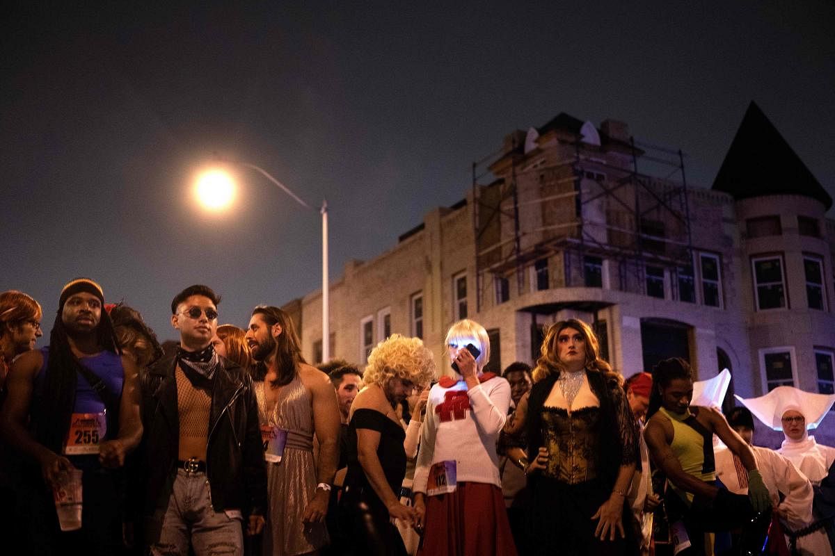 People wait to compete during the annual 17th Street High Heel Race hosted by the DC Mayor's Office of Lesbian, Gay, Bisexual, Transgender, and Questioning Affairs in Washington. Credit: AFP Photo