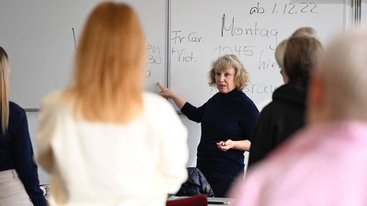 German teacher Petra Schulte gives a German language lesson to Ukrainian women refugees in Berlin, Germany. Credit: AFP Photo