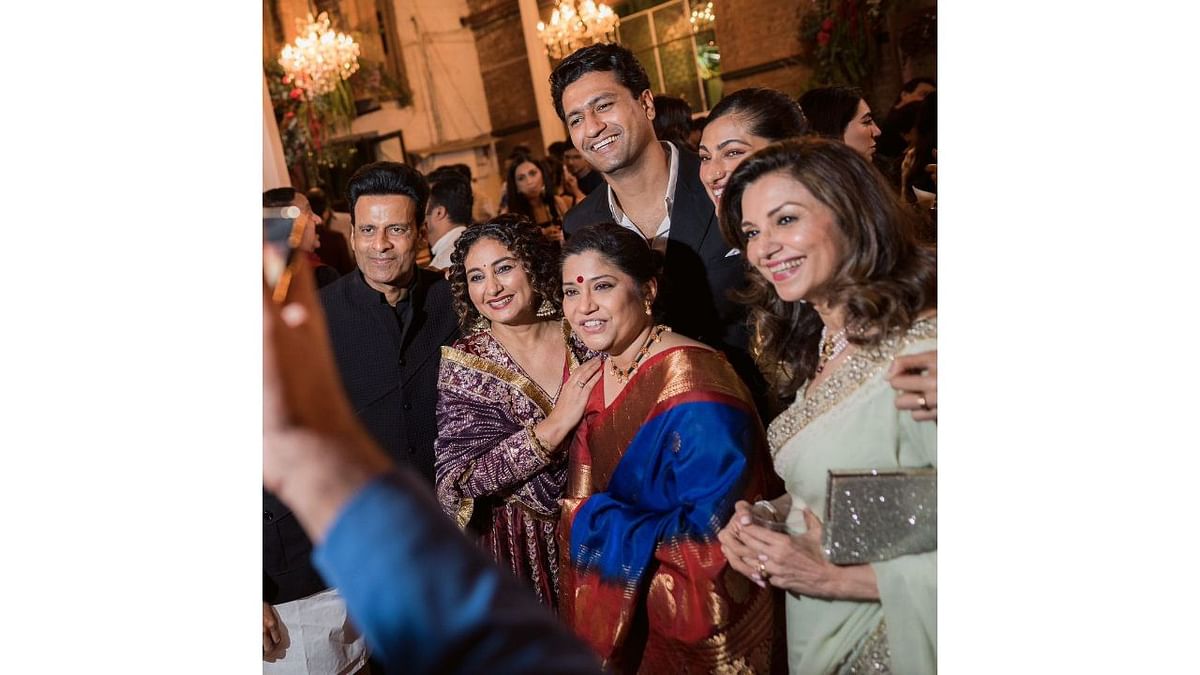 Vicky Kaushal and Manoj Bajpayee pose for a happy picture with others. Credit: Special Arrangement