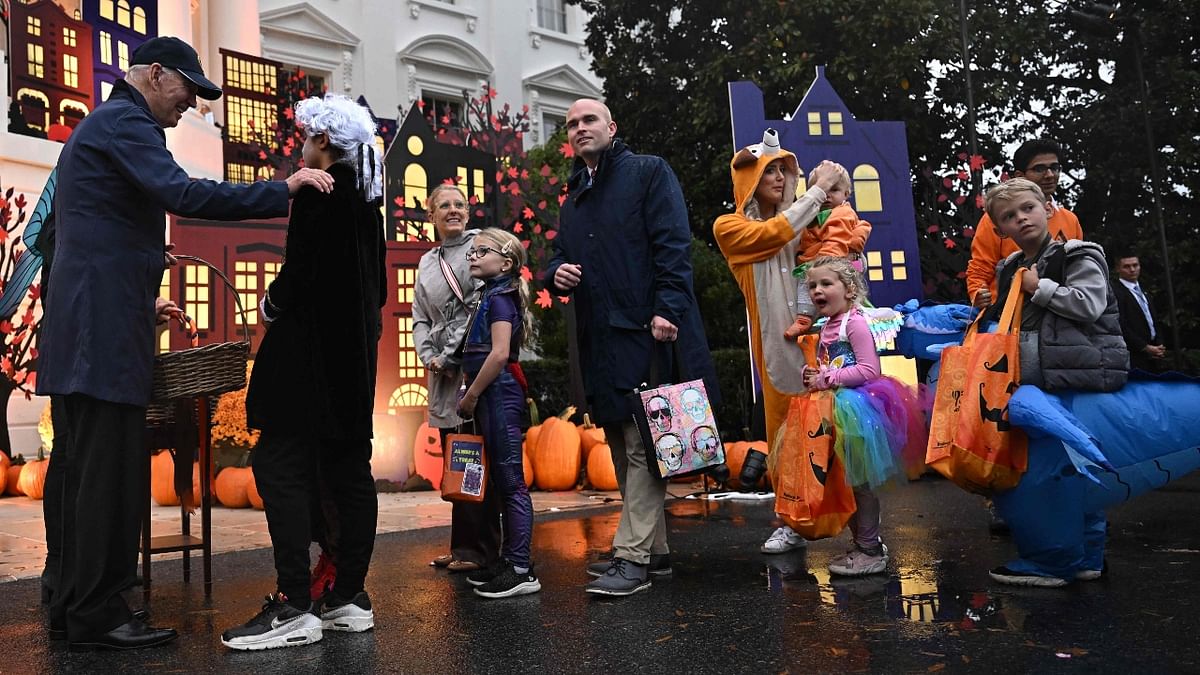 Treats were also distributed by representatives from the Department of Education, Department of Transportation, NASA, United States Secret Service, Peace Corps, White House Fire Brigade and White House staff among others. Credit: AFP Photo