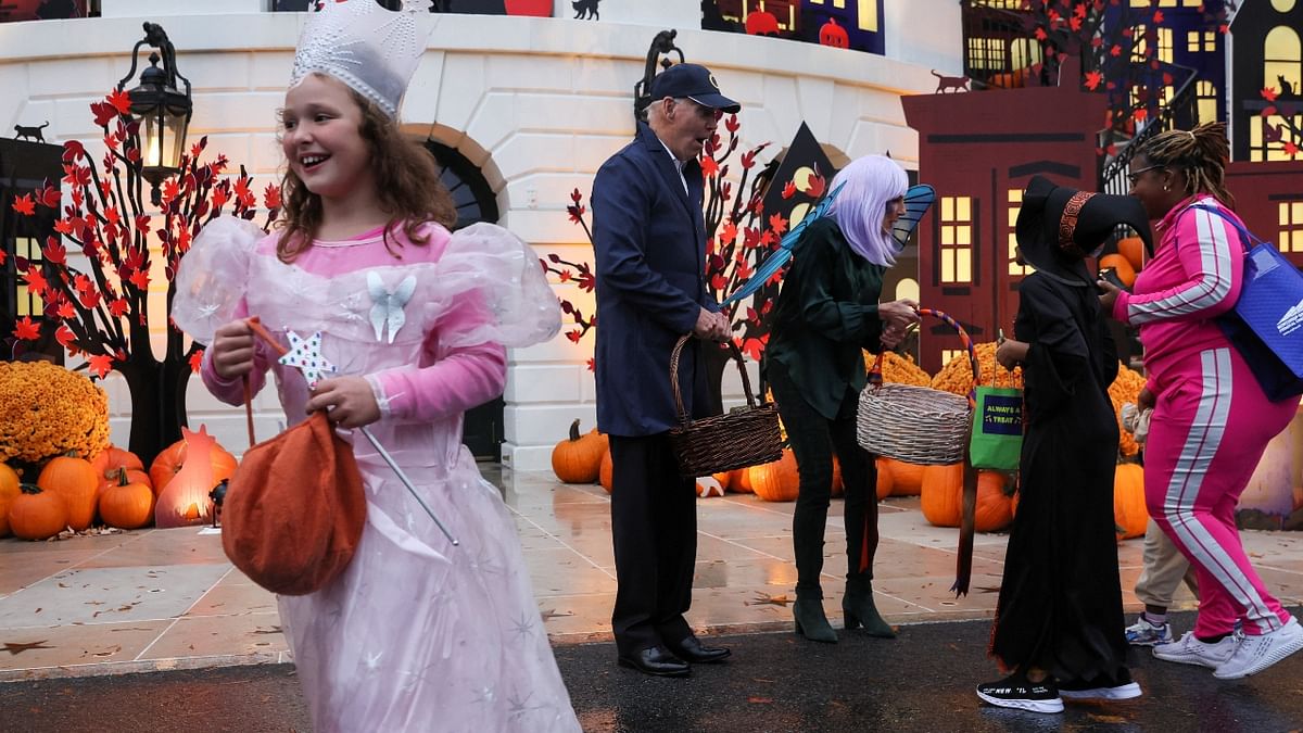 US President Joe Biden and first lady Jill Biden distributed Halloween candy to visiting children at the South Portico of the White House in Washington. Credit: Reuters Photo