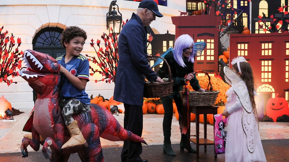 The Bidens, who were joined by their family members, briefly met the kids, handed out candy, waved and offered words of encouragement. Credit: Reuters Photo