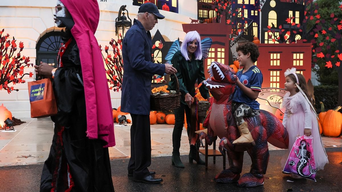 Biden, who was in Europe for Halloween last year, was particularly pleased with a tot dressed up as a potato-chip bag and posed for a picture with a young child dressed as Buzz Lightyear, a character from the