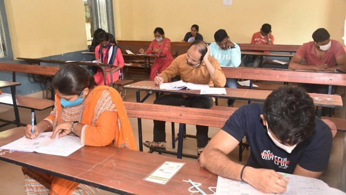 Paper leaks and postponement of government recruitment exams | Frequent paper leaks and postponement of government recruitment exams have dashed the hopes of youths working hard to get government jobs, leading to much resentment among the citizens. Credit DH Photo