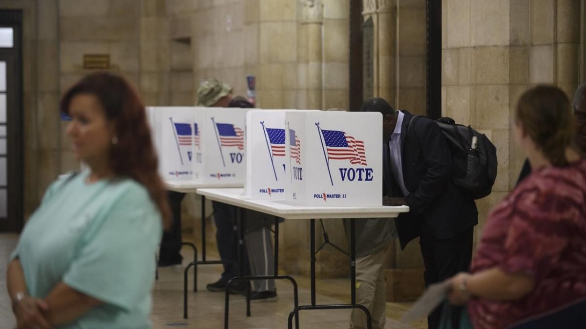 Voters fill out mail-in ballots at the Board of Elections office in the Allegheny County Office Building on November 3, 2022 in Pittsburgh, Pennsylvania. Credit: AFP Photo