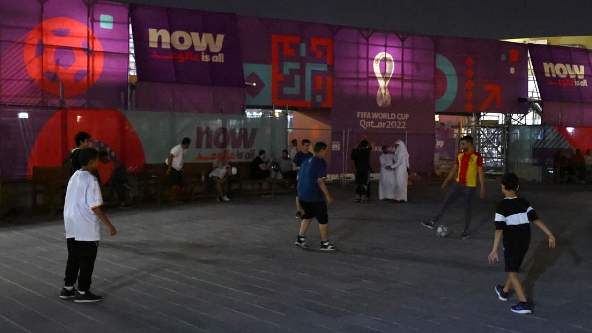 Youths play soccer at Souq Waqif, a traditional marketplace, ahead of the FIFA World Cup 2022 soccer tournament, in Doha, Qatar. Credit: Reuters photo