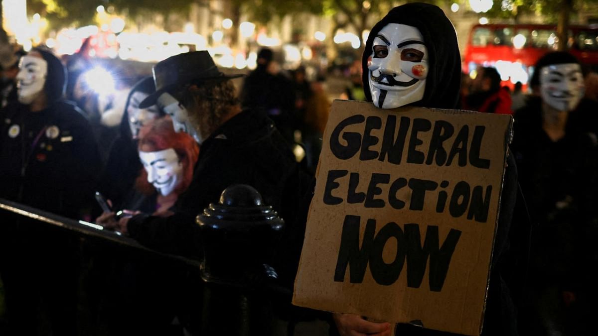 Protesters take part in the Million Mask March in London. Credit: Reuters photo