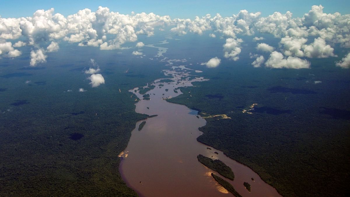 Aerial view showing the Essequibo River running in a section of the Amazon rainforest in the Potaro-Siparuni region of Guyana. Credit: AFP Photo