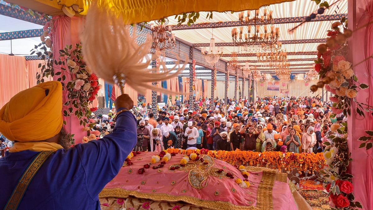 Devotees at the 553rd birth anniversary celebrations of Guru Nanak Dev in Kanpur. Credit: PTI Photo