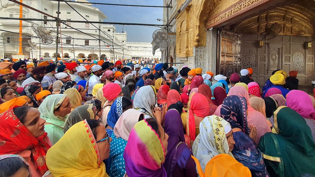 Devotees visit the Golden Temple on the occasion of the birth anniversary of Guru Nanak Dev in Amritsar. Credit: PTI Photo