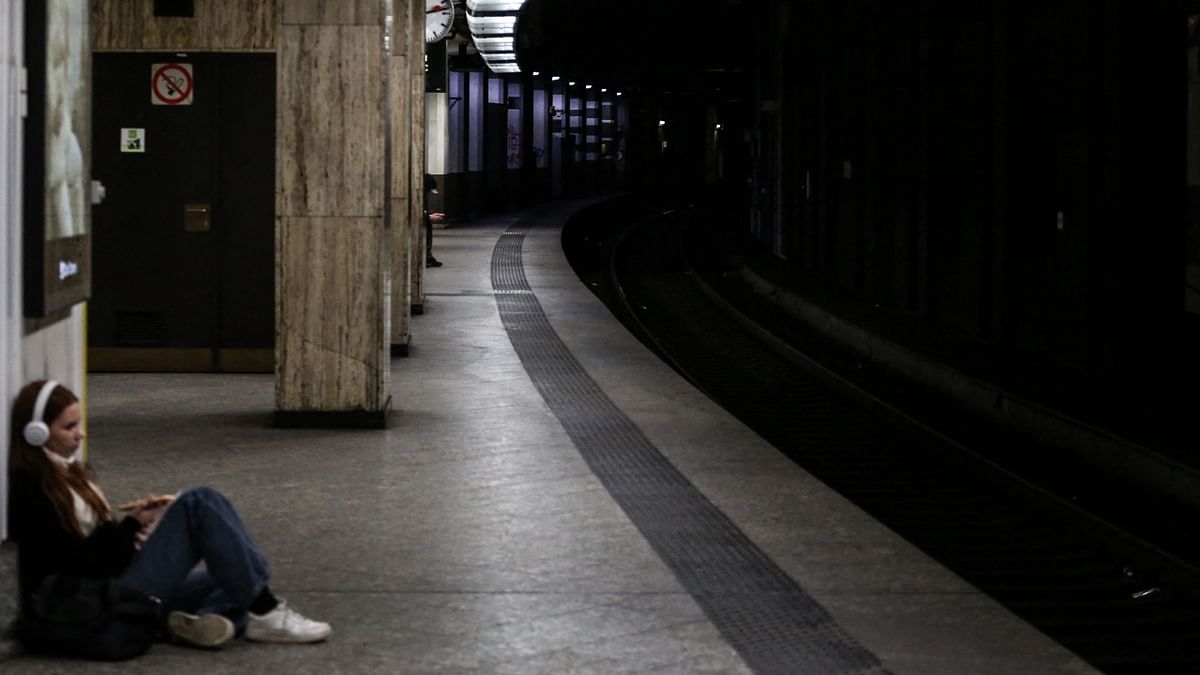 A traveller waits on a platform in Brussels Central train station on a national strike day organized by trade unions in Brussels, Belgium on November 9, 2022. Credit: AFP Photo