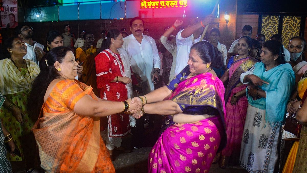 Shiv Sena (Uddhav Balasaheb Thackeray) workers celebrated after party MP Sanjay Raut was granted bail in a money laundering case linked to alleged irregularities in the redevelopment of 'Patra Chawl, in Thane. Credit: PTI Photo