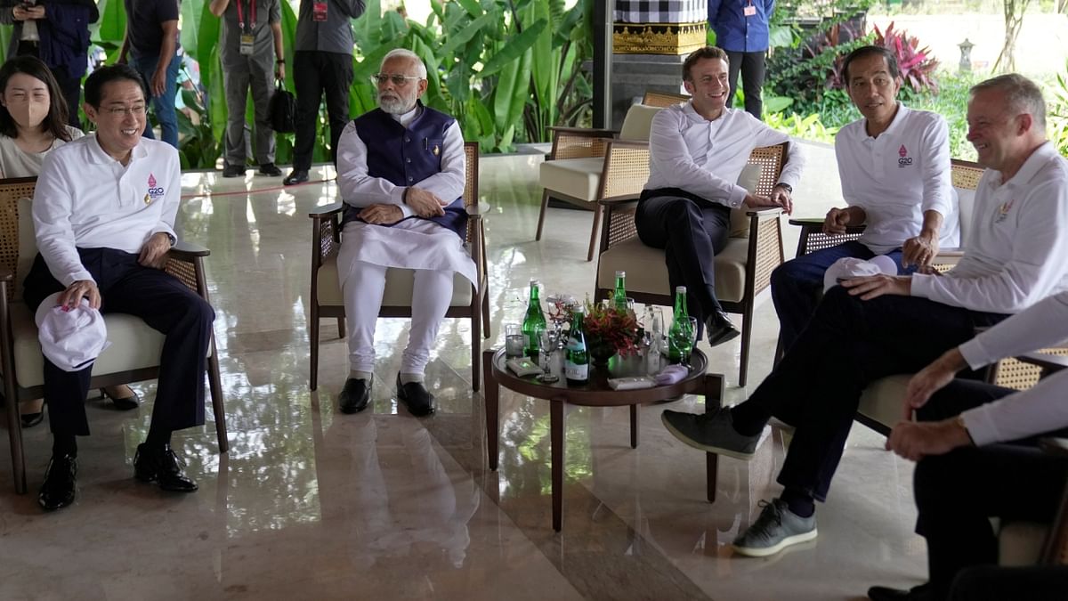 Prime Minister Narendra Modi with Japanese Prime Minister Fumio Kishida, French President Emmanuel Macron, Indonesian President Joko Widodo and Australian Prime Minister Anthony Albanese share a light moment prior to the start of a mangrove planting event at Ngurah Rai Forest Park, on the sidelines of the G20 summit in Denpasar, Bali, Indonesia. Credit: Reuters Photo
