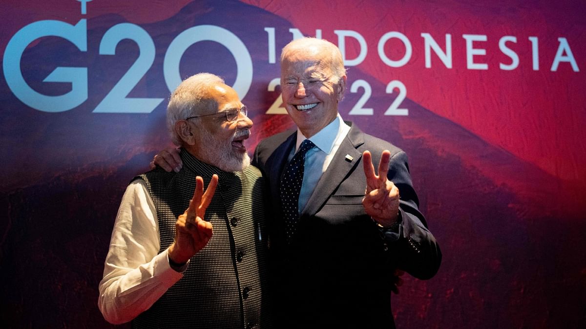 Prime Minister Narendra Modi and US President Joe Biden pose for a photo in a hallway during the G20 Summit in Nusa Dua, Bali. Credit: AFP photo