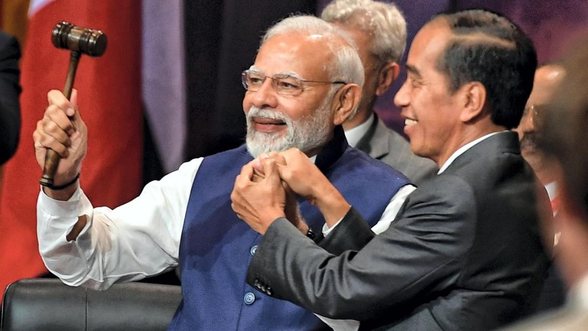 Prime Minister Narendra Modi, left, and Indonesia's President Joko Widodo take part in the handover ceremony at the G20 Leaders' Summit, in Nusa Dua, Bali, Indonesia, Wednesday November 16, 2022. Credit: PTI Photo