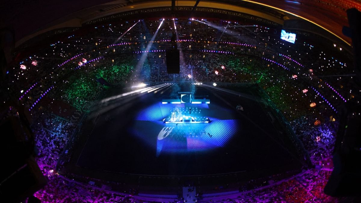General view of singer Jung Kook and performers during the opening ceremony. Credit: Reuters Photo