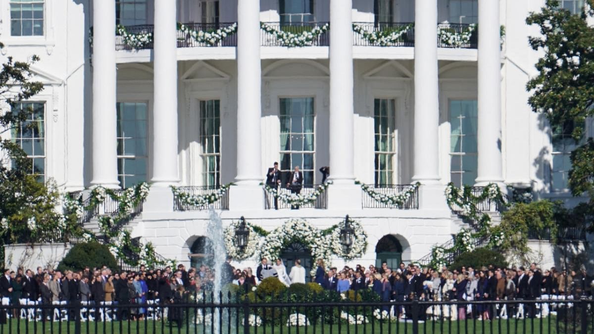 Naomi Biden, granddaughter of U.S. President Joe Biden, and Peter Neal, 25, center, are married on the South Lawn of the White House in Washington, D.C. Credit: Reuters Photo