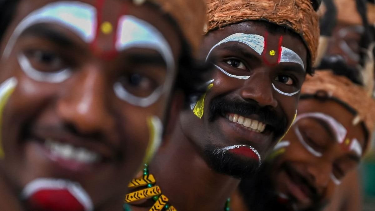 Tribals of Velliankani paramparas community gesture during an event in Chennai. Credit: AFP Photo