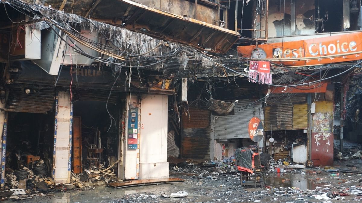 Over 50 shops were charred in a massive fire in the wholesale market of Bhagirat Palace area in North Delhi's Chandni Chowk, police said. Credit: PTI Photo