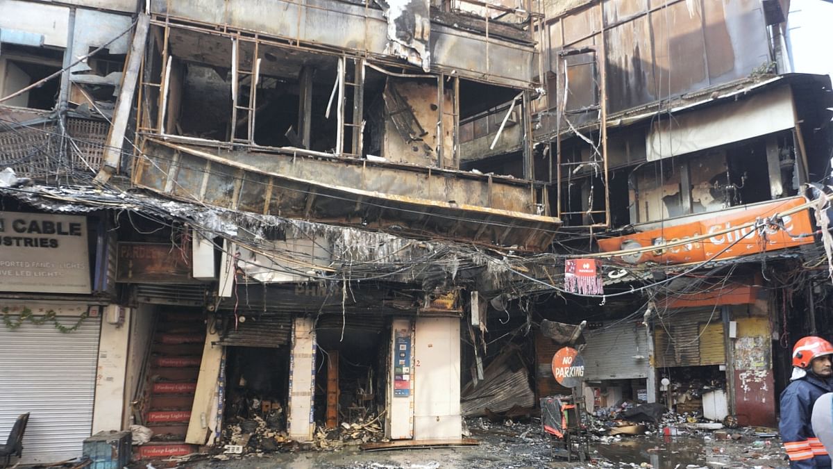The fire that broke out at one shop soon spread to adjacent ones, all dealing in supplying electrical appliances, officials said. Credit: PTI Photo