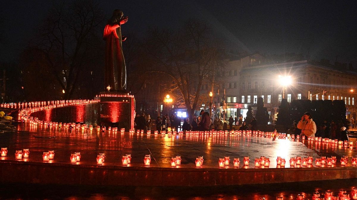 Local residents light candles to commemorate the victims of the 1932-33 Holodomor, Ukrainian for
