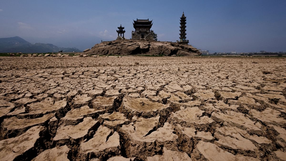 A view of pagodas on Louxingdun island that usually remains partially submerged under the water of Poyang Lake, which is facing low water levels due to a regional drought in Lushan, Jiangxi province, China. Credit: Reuters Photo